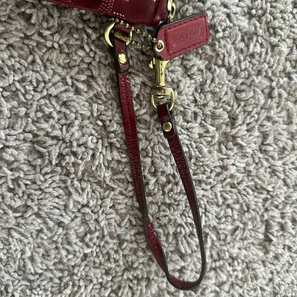 Preloved Coach Maroon Wristlet with Circular Design - Picture 3 of 5